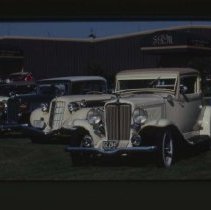 1932 Auburn Coupe in front of 1935 - 1936 Auburn