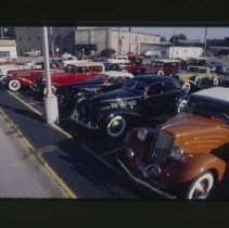 1934 Auburn Phaeton and a Cord 810 - 812 Sedan in a parking lot