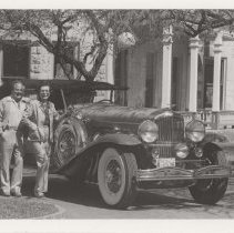 Couple next to a Duesenberg Model J-453