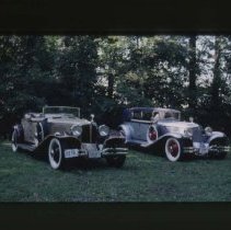 L - 29 Cord Cabriolet and an L - 29 Cord Phaeton in a forest