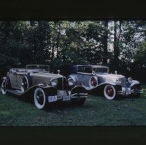 L - 29 Cord Cabriolet and an L - 29 Cord Phaeton in a forest
