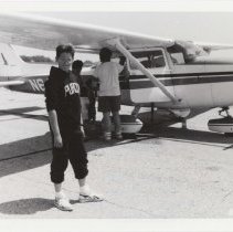 Person in front of a Cessna 205