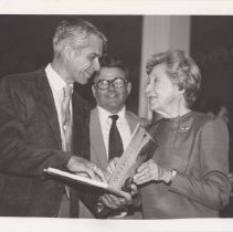 Three people reading the Rolling Sculpture book