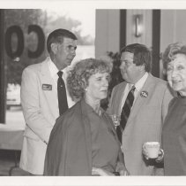 Four people in the museum showroom
