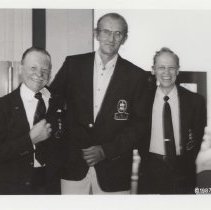 Three people in the museum showroom
