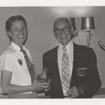 Ken VanAusdal and woman holding an ACD Club award