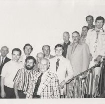 Group of men on the museum staircase
