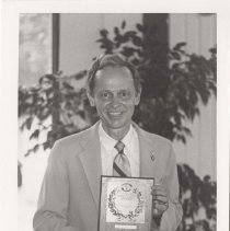 Paul Bryant holding his ACD Club award