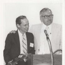 Two men at a podium