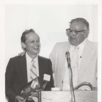 Two men at a podium
