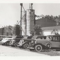 Lineup of Auburns and Cords on a farm