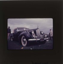 Black Packard with a cream colored convertible top