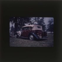 Back of a two tone Rolls-Royce with a phaeton body style