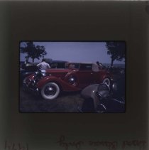 Convertible style Packard with other Packards around it