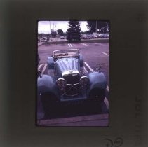 Light blue Jaguar with "JAGUAR" plate