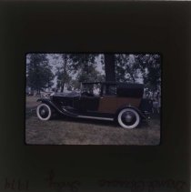 Side view of a Rolls-Royce with patterned back doors and rear