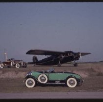 1928-1930 Auburn Speedster and a 1931 Auburn Speedster with a plane