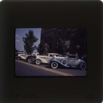 1931 Auburn, 1935 or 1936 Auburn, and other cars in front of the museum