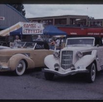 Cord 810-812 Cabriolet and 1935 Auburn 851 Phaeton in front of NATMUS