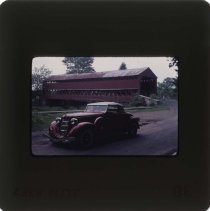 1935 Auburn 851 Cabriolet in front of a covered bridge