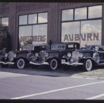 Two 1933 Auburns and a 1931 Auburn Speedster in front of the museum