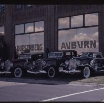 Two 1933 Auburns and a 1931 Auburn Speedster in front of the museum