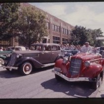Three 1935 or 1936 Auburns in font of the museum