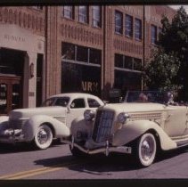 1935 Auburn 851 Cabriolet and a Cord 810-812 Sedan in front of the museum