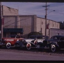 1935 or 1936 Auburn Cabriolet, a Cord L-29 Phaeton, and a Cord 810-812 Sedan