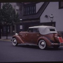 1934 Auburn Phaeton in front of a tavern style building