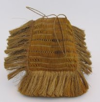 Kete square shaped with a  fringe on the side and bottom