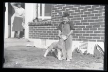 Young boy with pet lamb