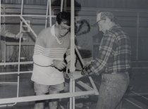 Donald Butler and Jim Rayer assembling a shelving unit