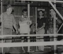 Men erecting a frame