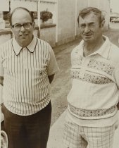 Eric Batchelor and another man in a driveway