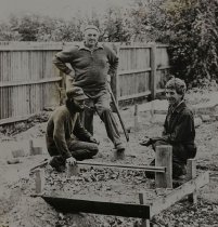 Workmen laying concrete