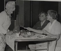 Women selling raffle tickets