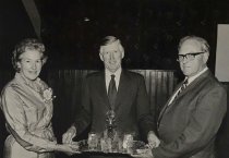 Arthur Kirby presenting Mr and Mrs Rattray with a tray