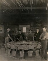 Men building carrirage wheel at Dash's Carriage Works