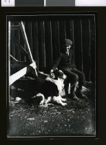 Young man pating dog