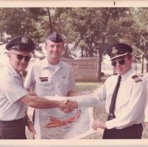 Eugeniusz Maliszewski holding a Dash 7 picture, ca. 1975