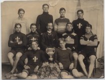 Cycling team with Leavitt & Bill trophy, c. 1903