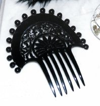 Ornamental hair comb on display in Fallon House