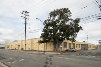 Oblique view of Sunlite Baking Co. primary and north facades looking southw
