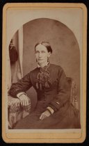 Portrait of woman with tassled ribbon collar, c. 1865