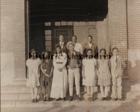 Photograph from the Parker-Gray School Collection. Students in play posing in front of school building, ca. 1928.
