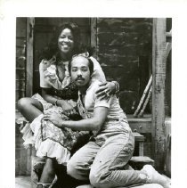 Black and white photograph of Laura English-Robinson and an unidentified man posed on stage in costume in "Porgy and Bess", October 1978