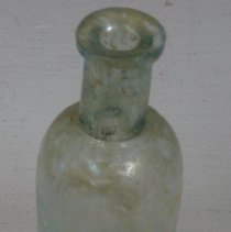 Field Archeology, round glass bottle