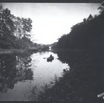 Dr. Chevalier Jackson in rowboat on the mill pond at Sunrise Mill