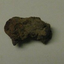 Unidentifiable nail fragment